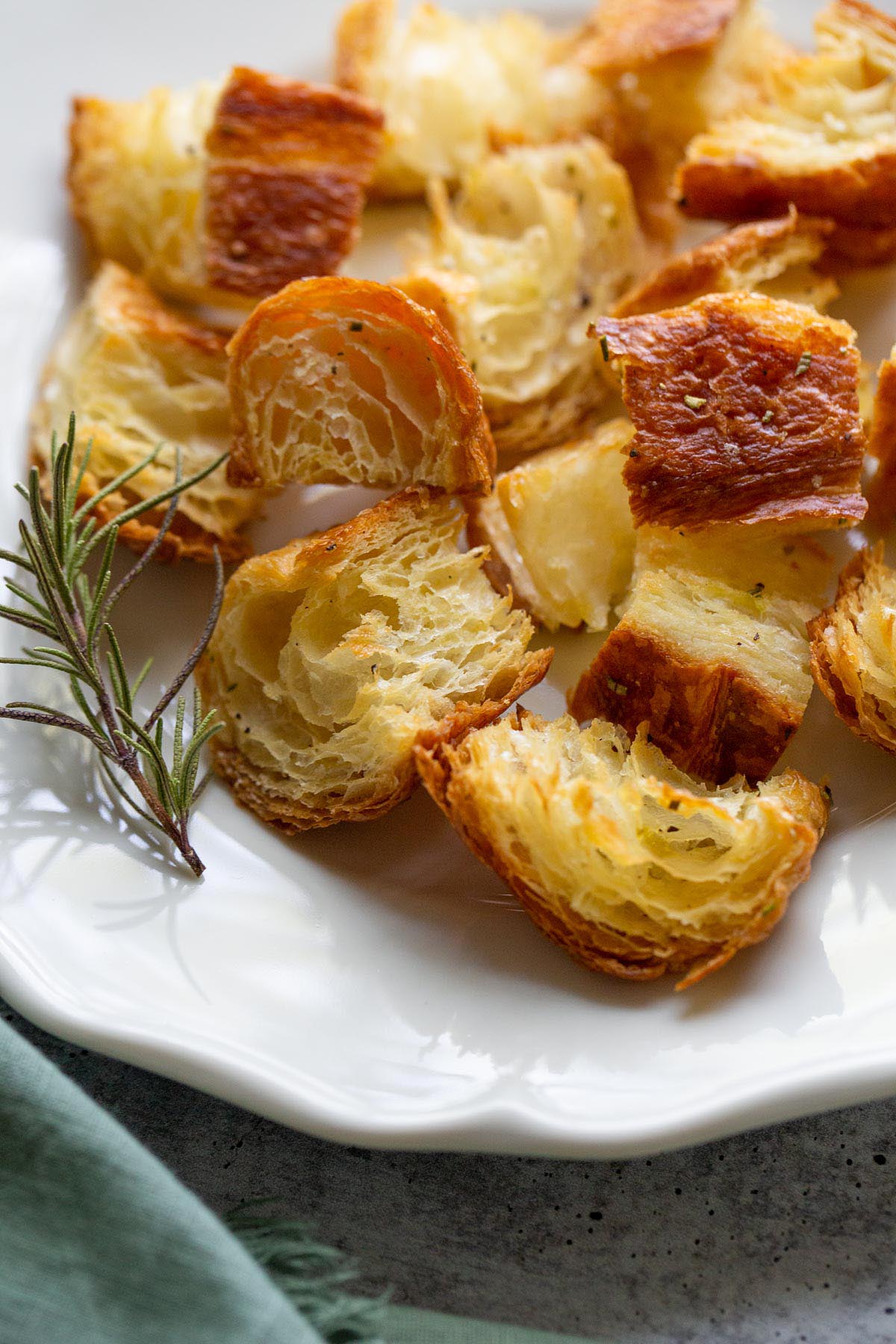 rosemary croissant croutons with a sprig of rosemary