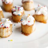 Banana bites with whipped cream and sprinkles