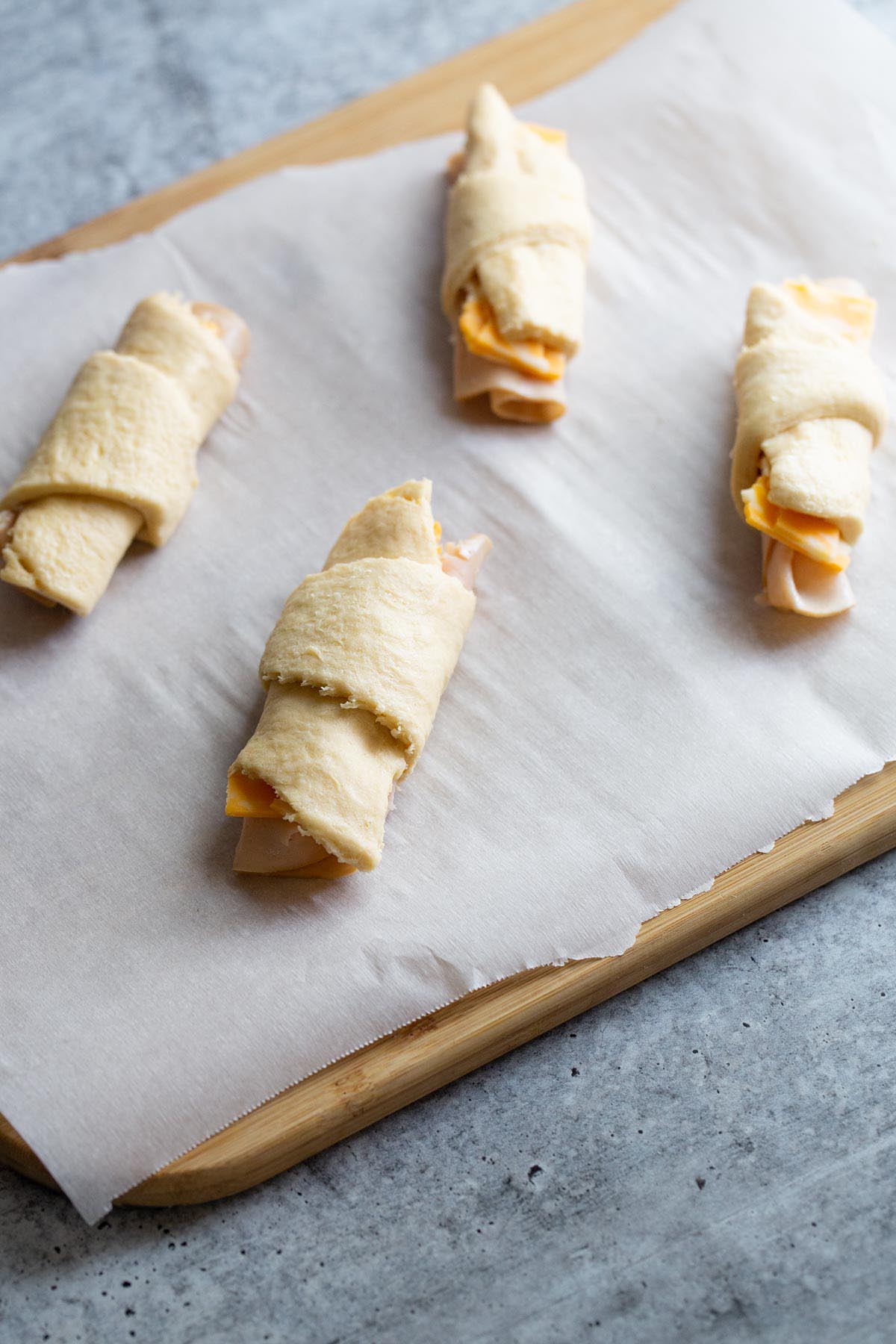 Rolled up uncooked crescent rolls.