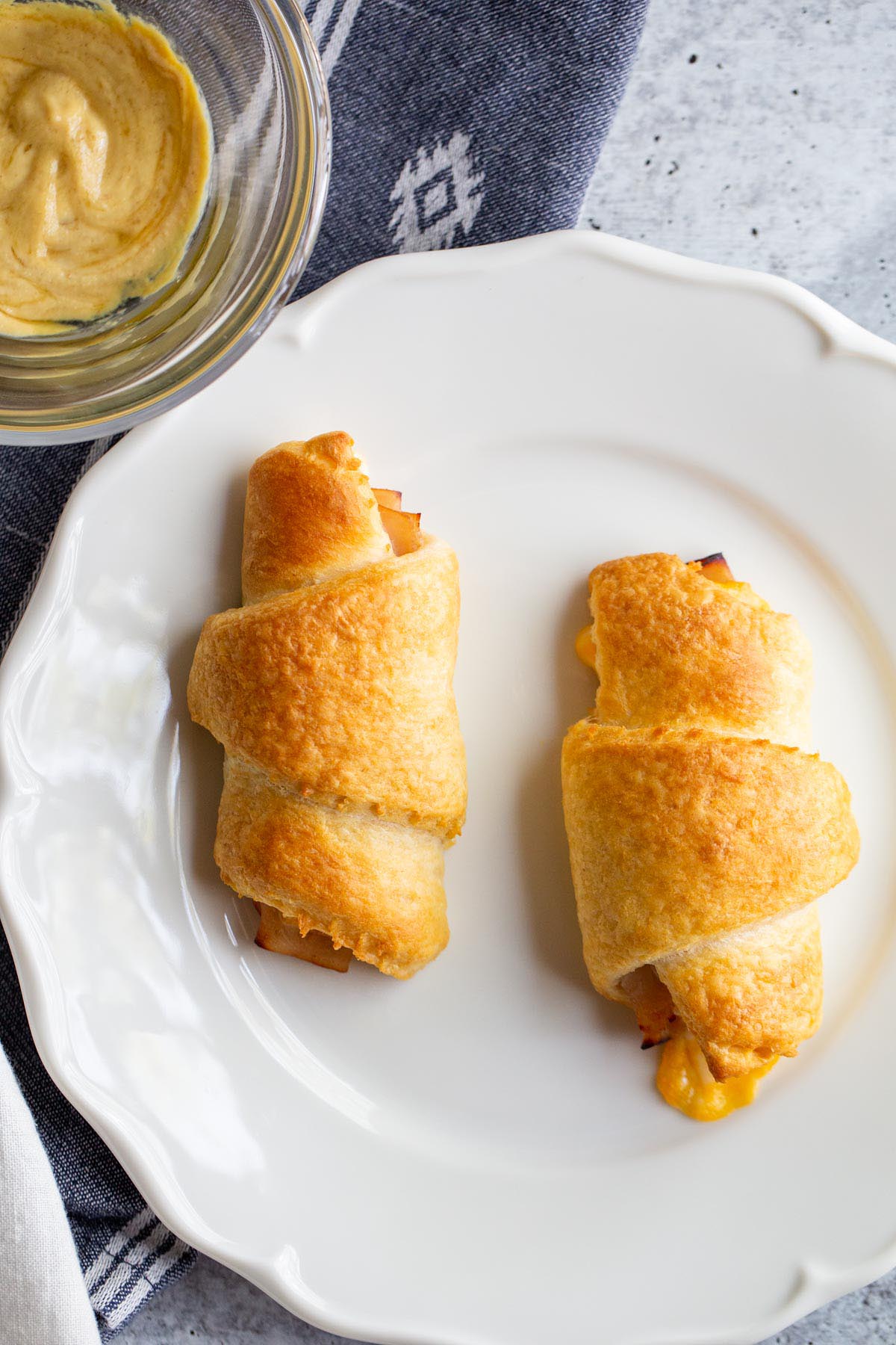 Turkey cheese crescent rolls on a white plate.