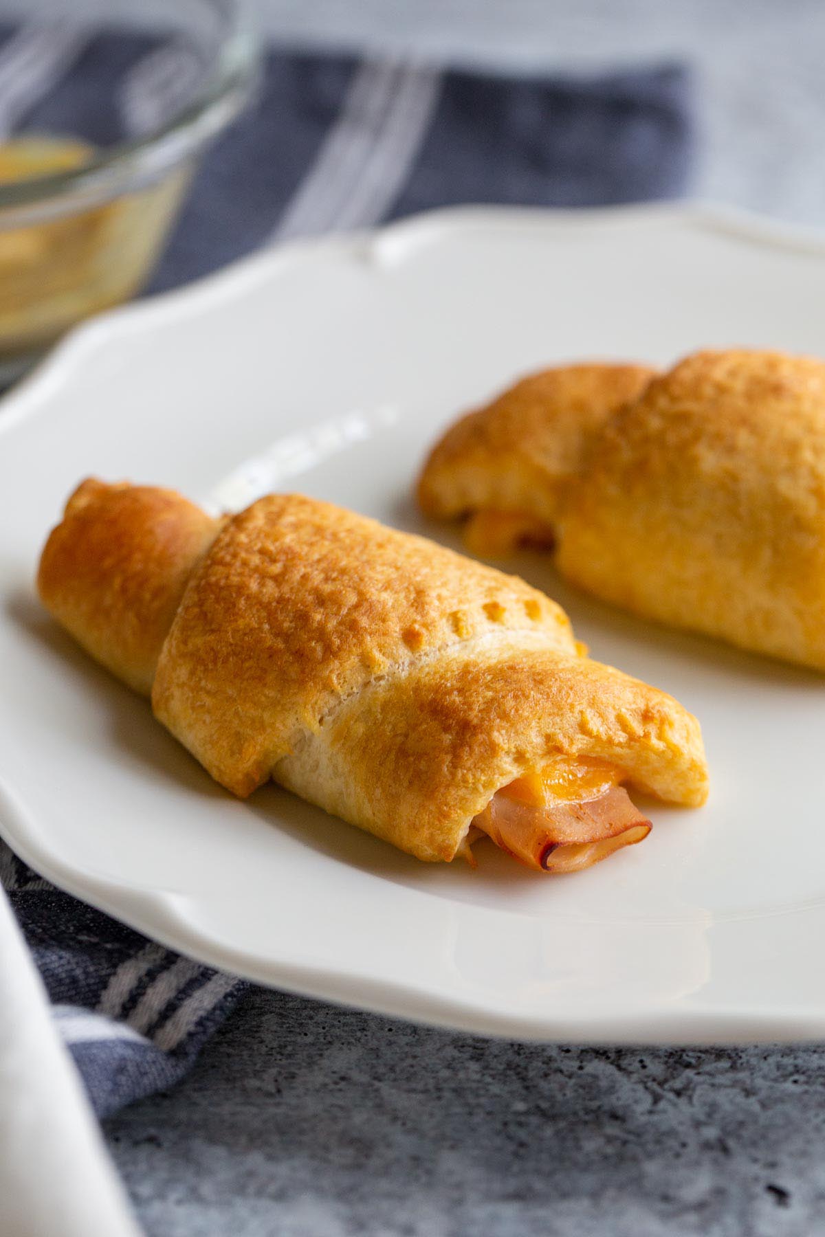 Turkey cheese crescent rolls on a white plate.