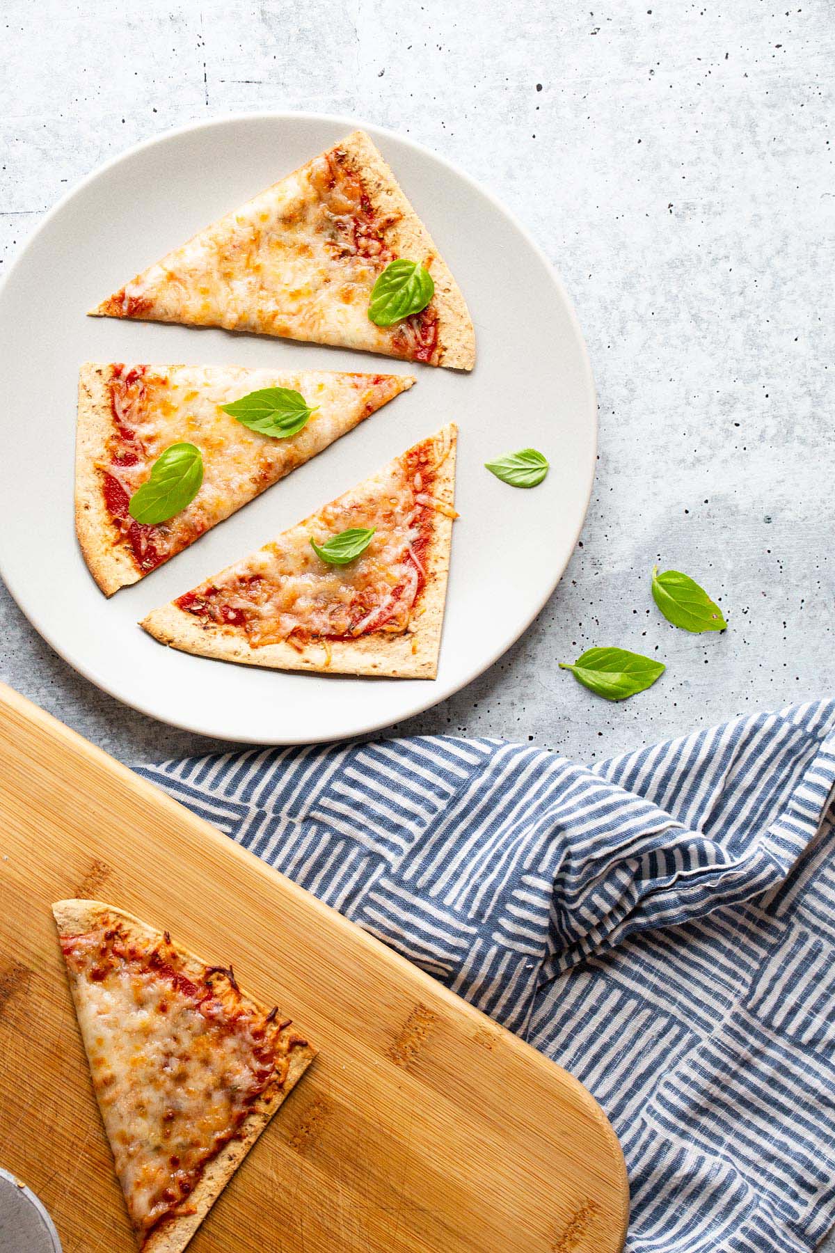 Air fryer flatbread pizza sliced into triangles.