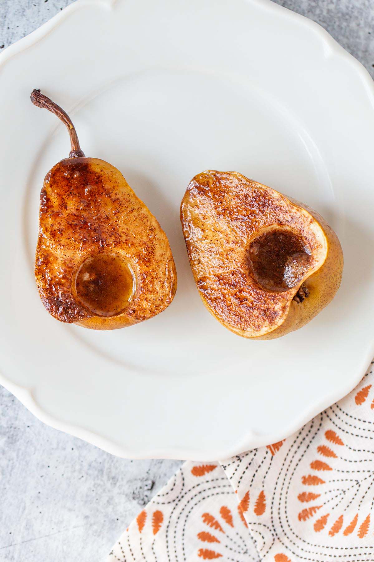 Air fried pears on a white plate.