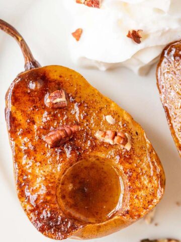 air fryer baked pears topped with chopped pecans