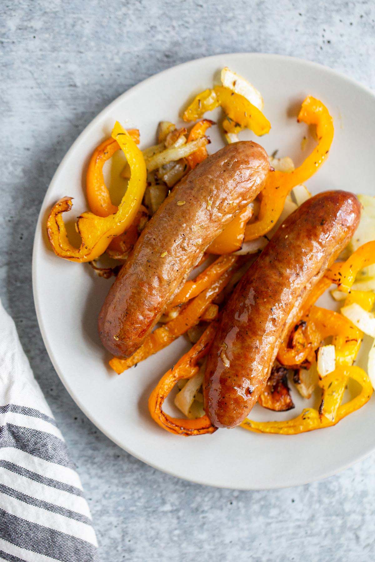 Sausage and peppers on a plate.