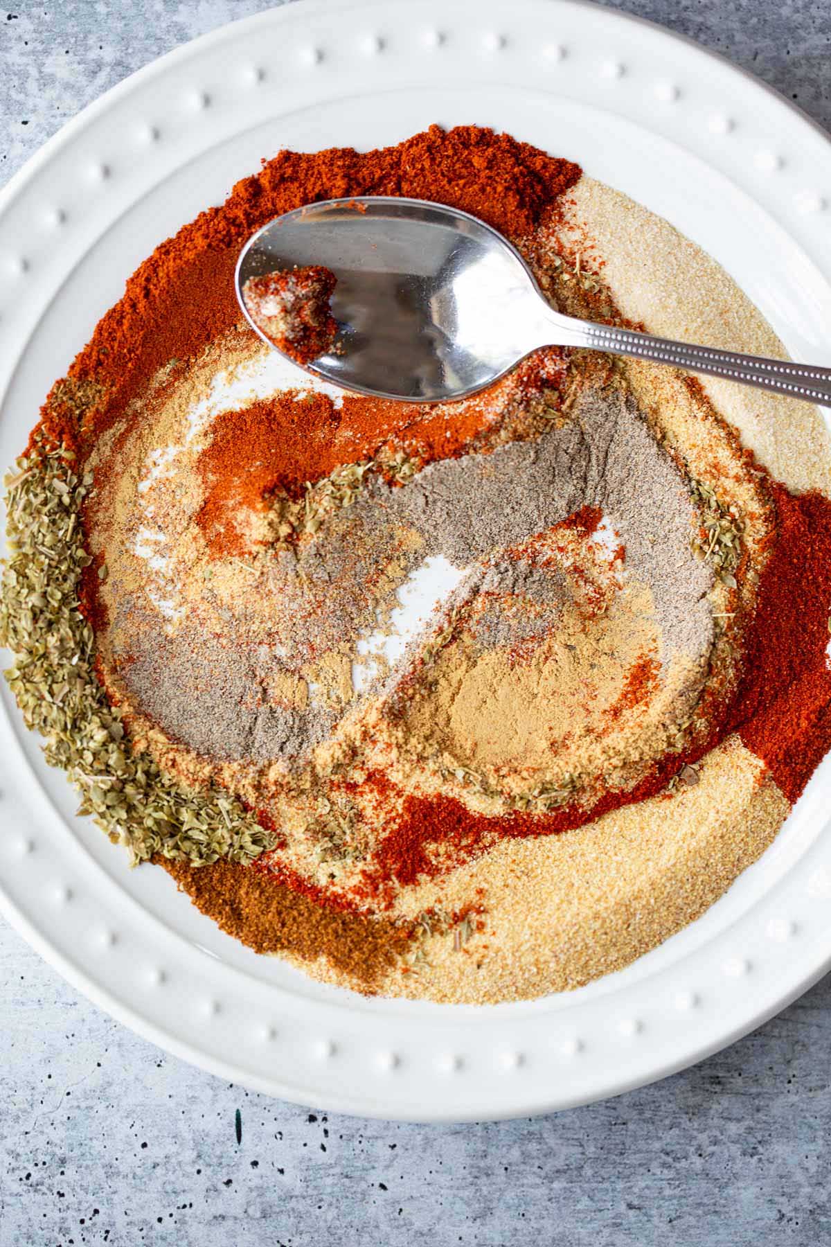 Swirling peri peri seasoning to mix