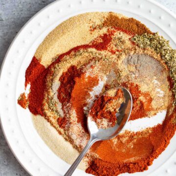 Swirling peri peri seasoning to mix