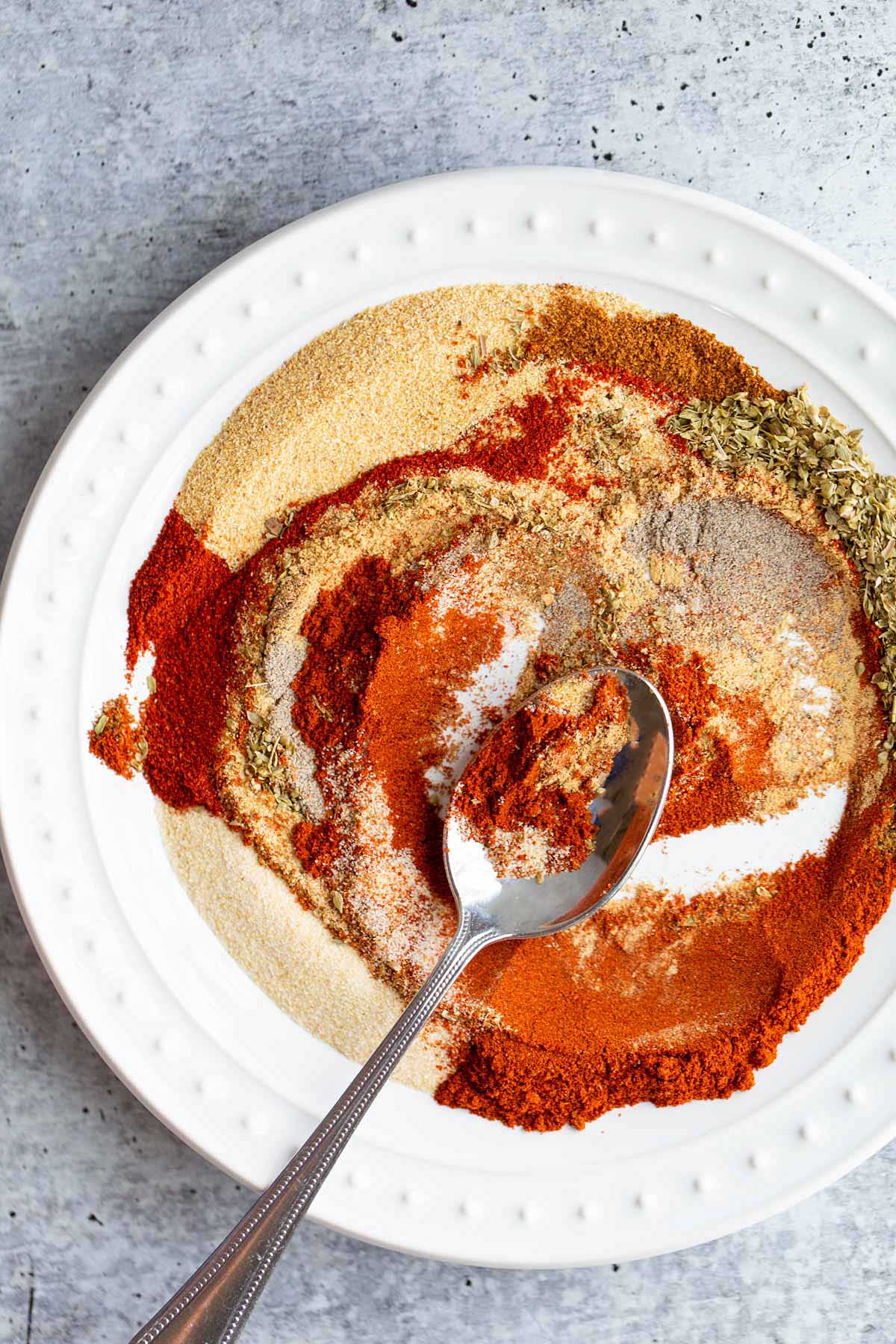 Swirling peri peri seasoning to mix