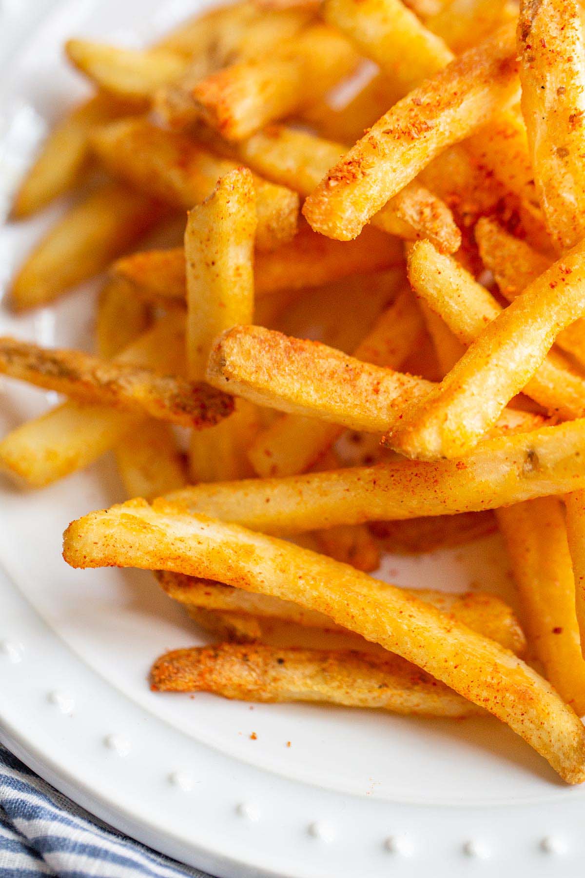 French fries with peri-peri seasoning up close.