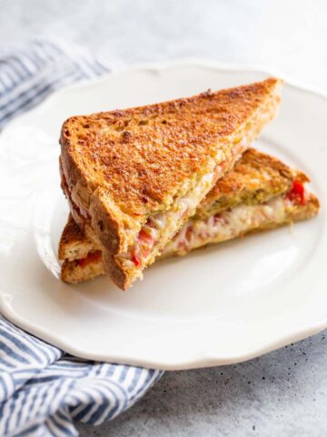 Caprese grilled cheese on a plate.