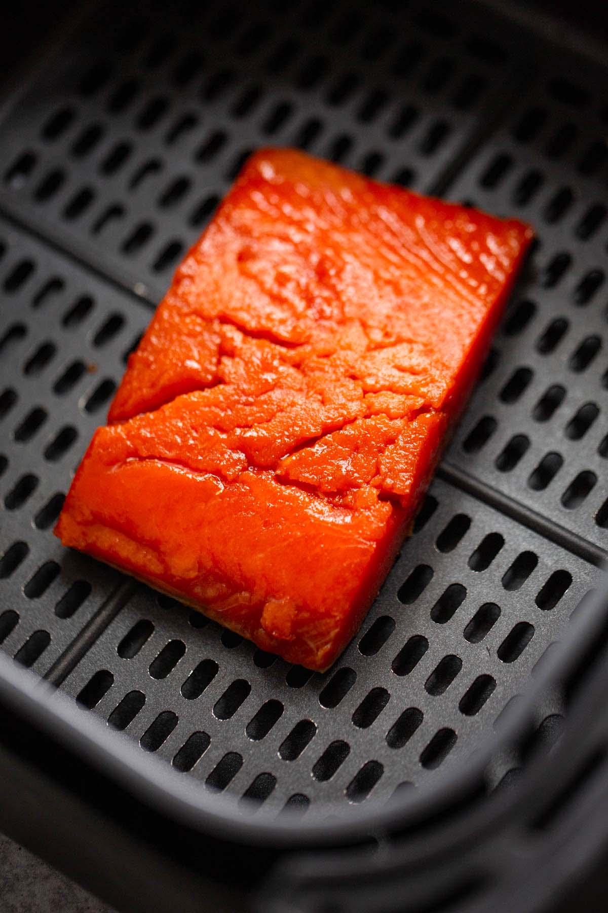 Uncooked salmon in the air fryer.