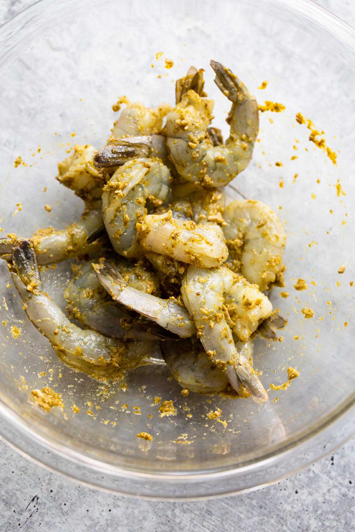 Raw shrimp tossed with pesto.