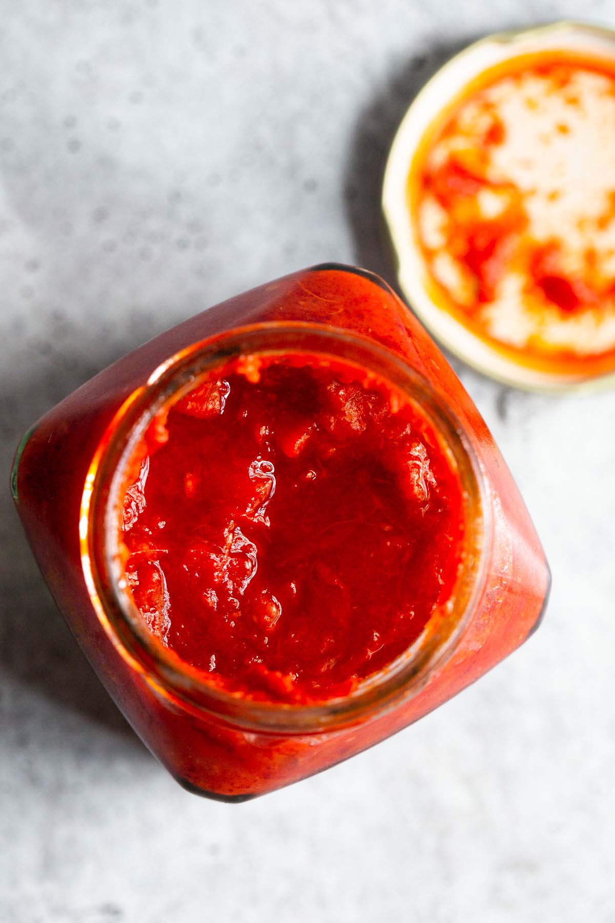 Opened jar of harissa.