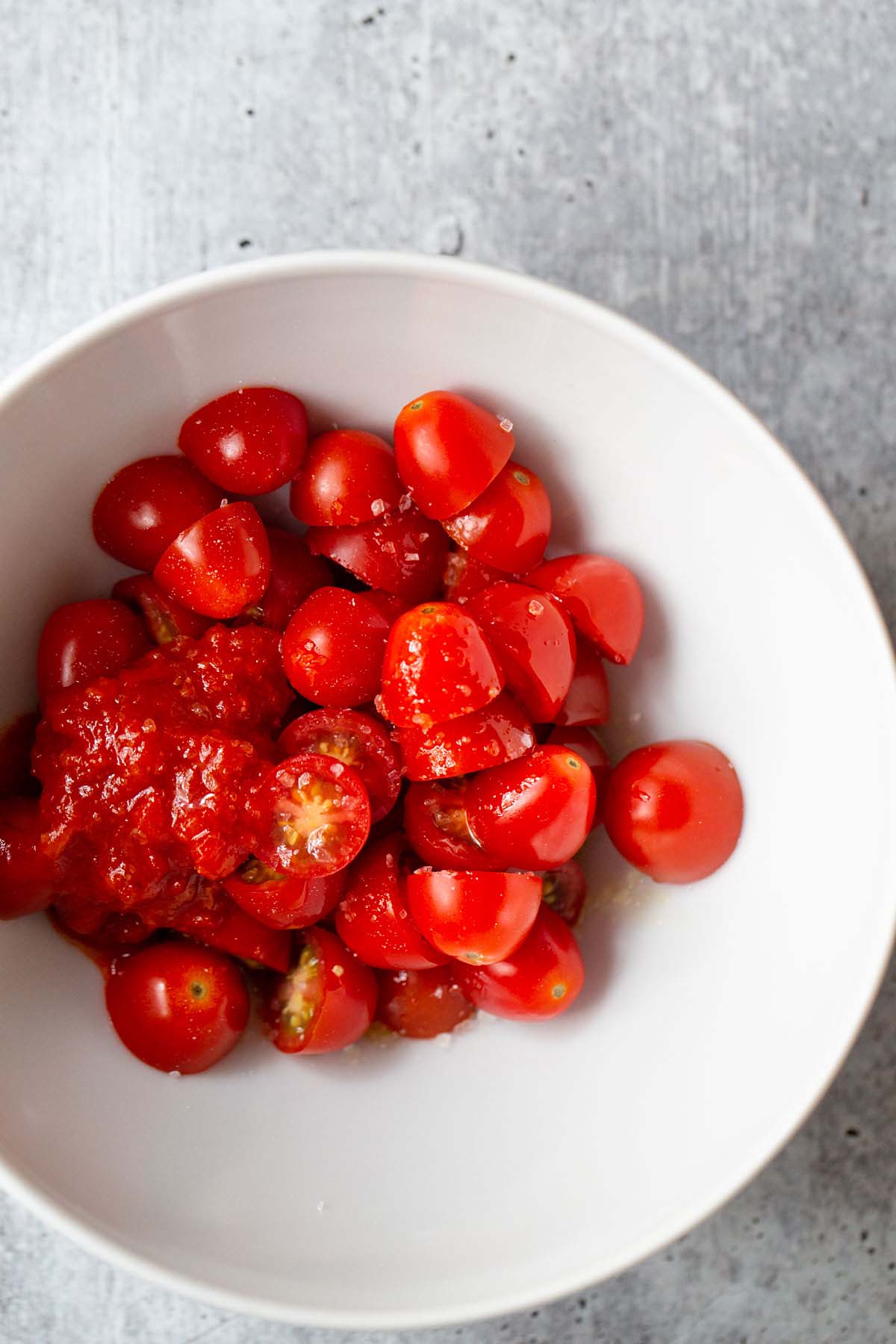 Cherry tomatoes mixed with harissa.