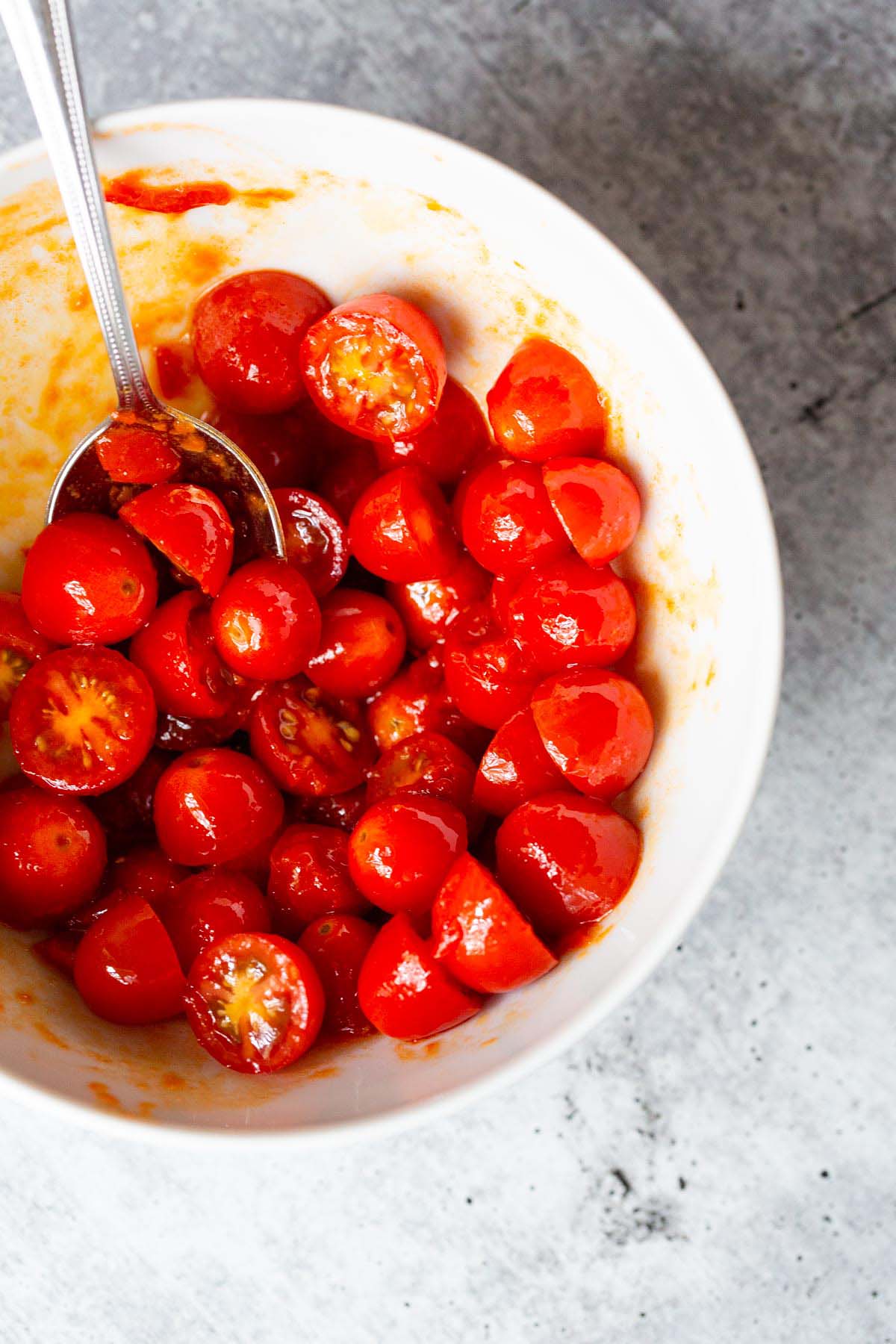 Cherry tomatoes mixed with harissa.