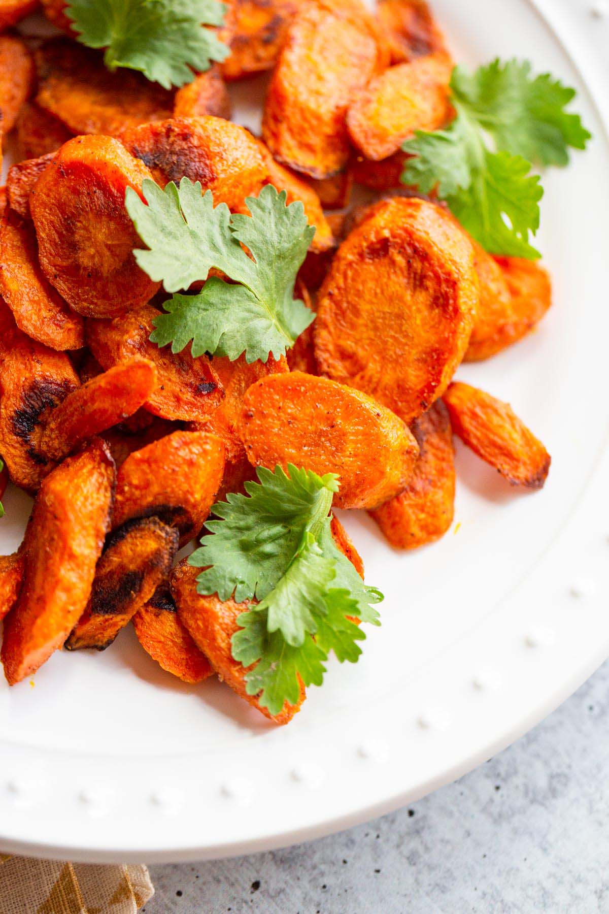 Roasted ras el hanout carrots with fresh cilantro.