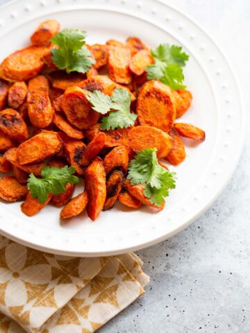 Roasted ras el hanout carrots with fresh cilantro.