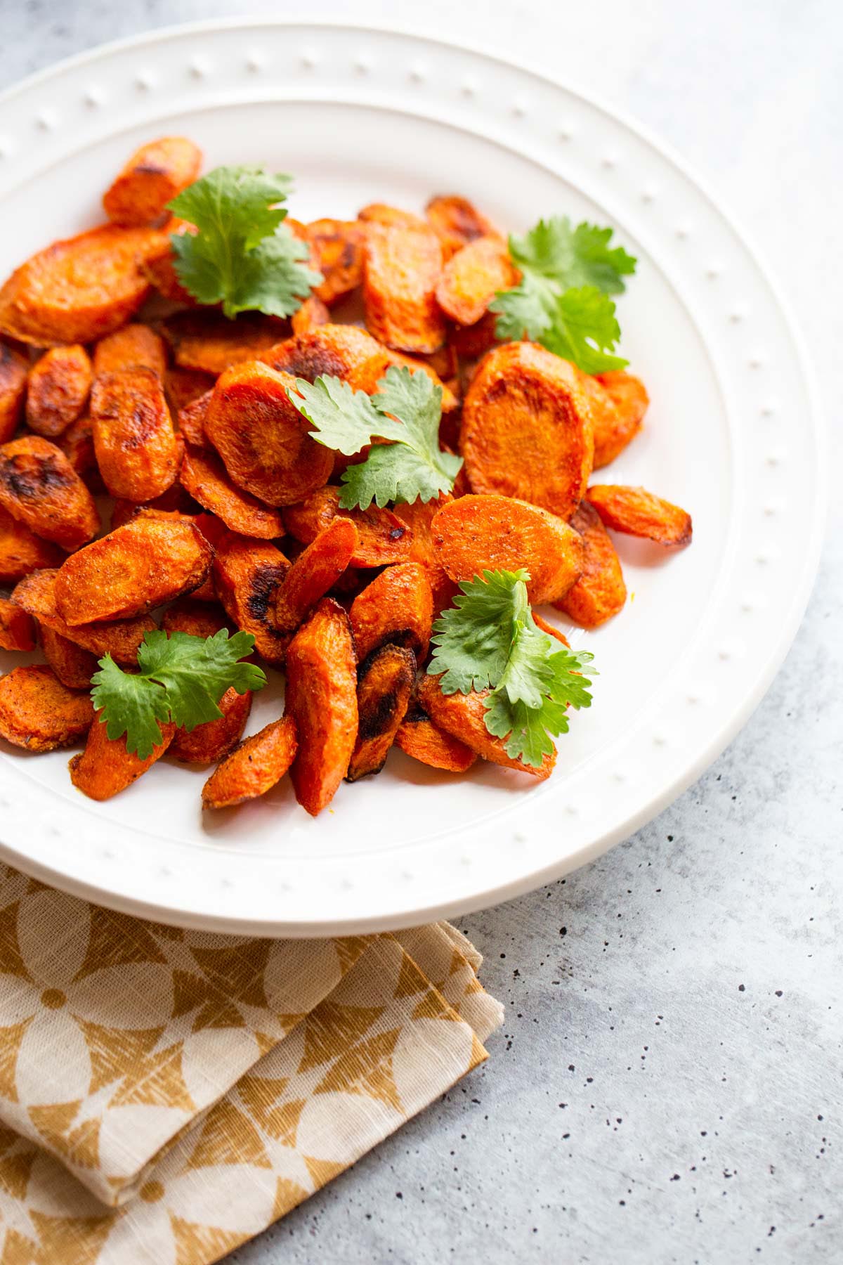 Roasted ras el hanout carrots with fresh cilantro.