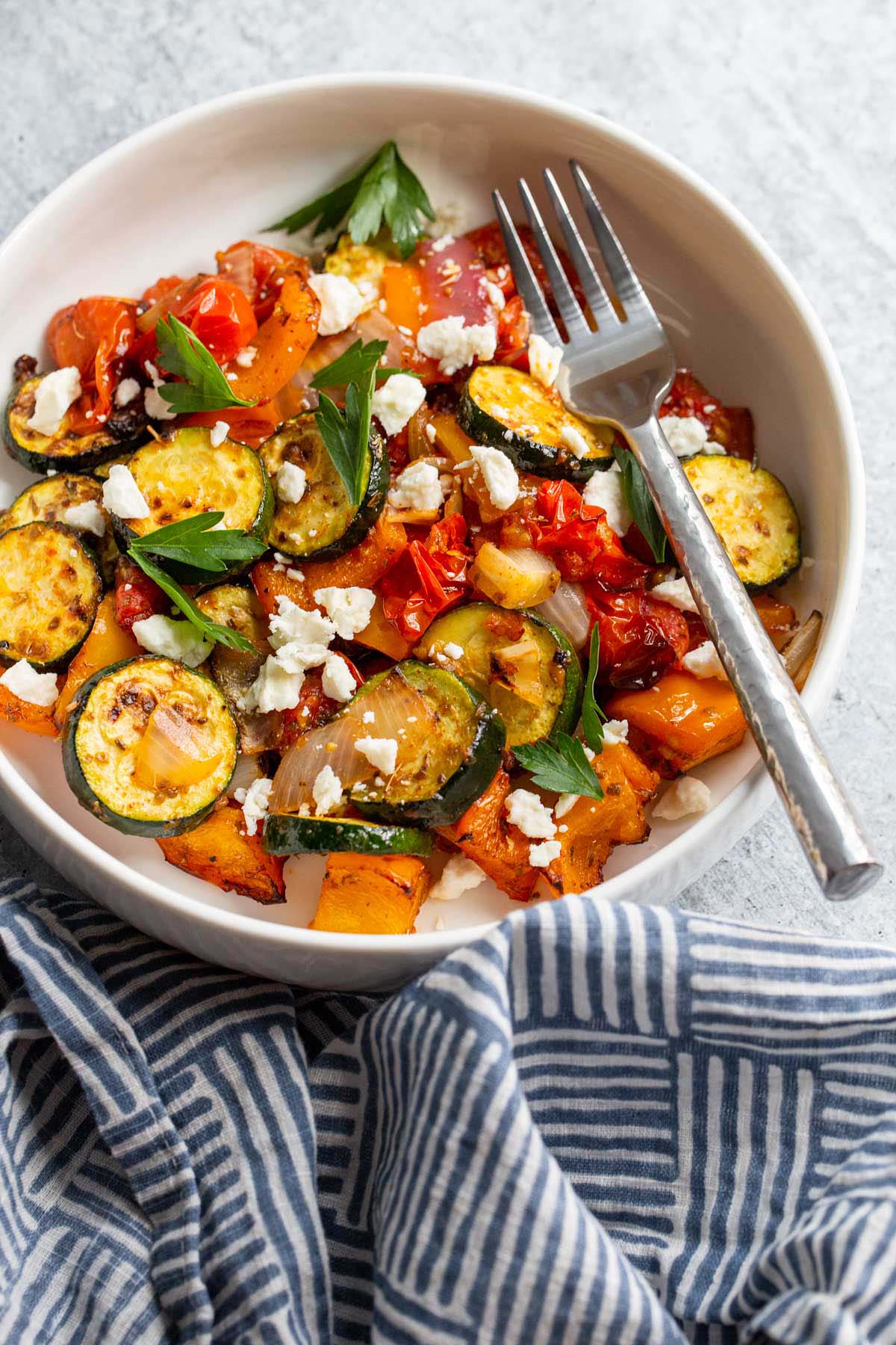 Air fried mediterranean vegetables with feta and parsley.