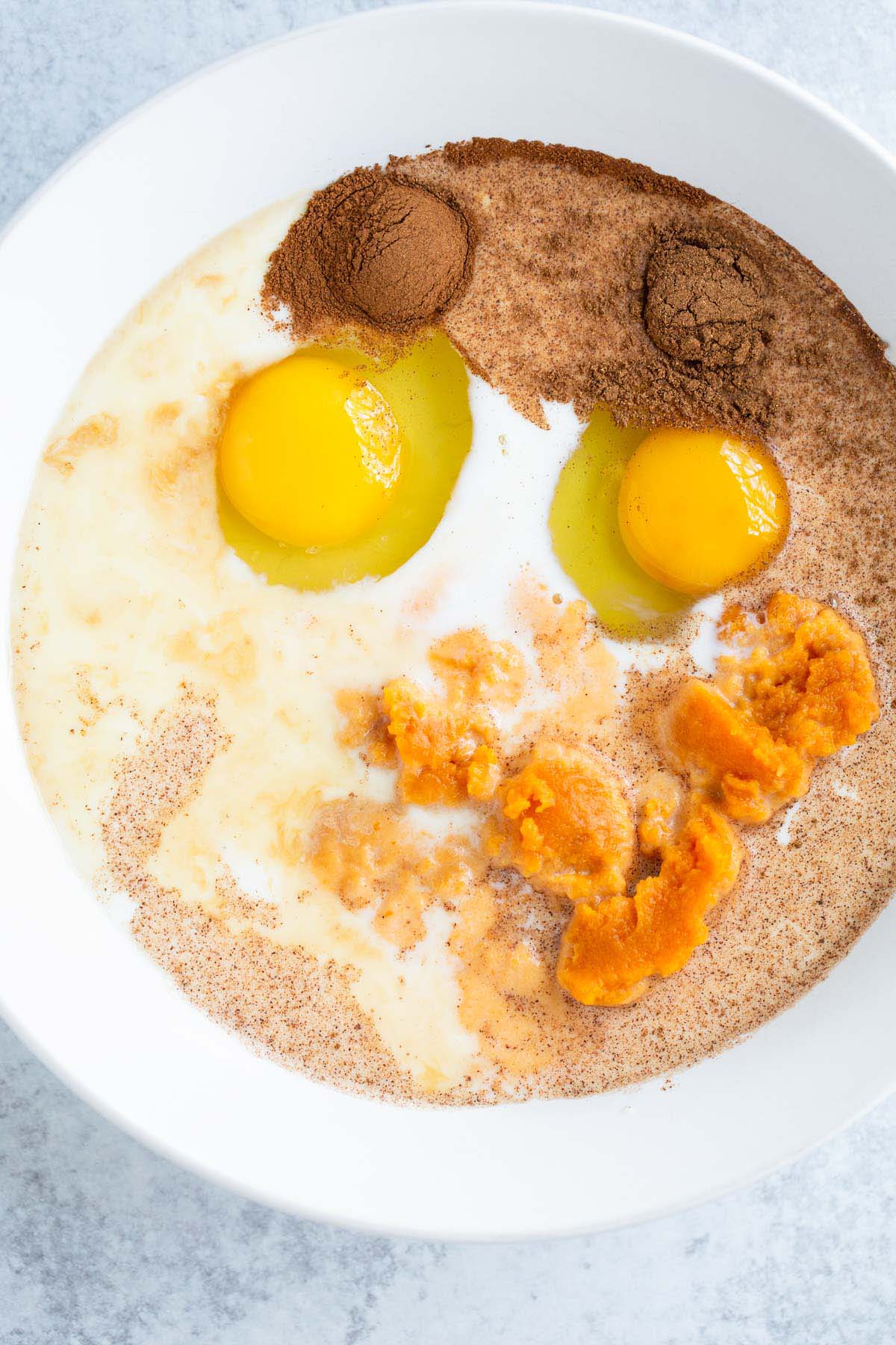 Pumpkin french toast custard ingredients in a bowl.