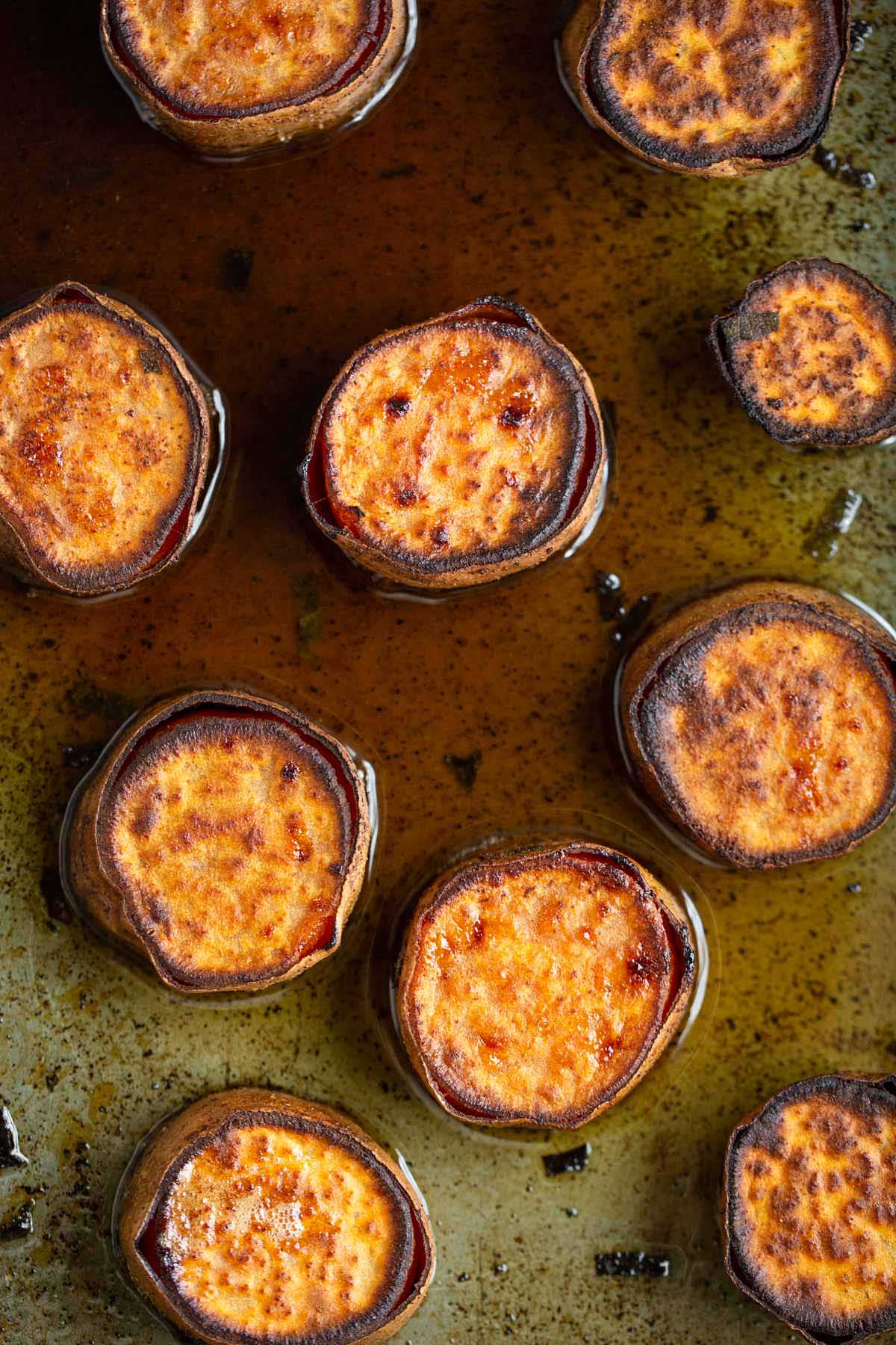 Roasted sweet potatoes in a pan.