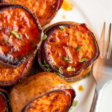 Melting sweet potatoes with sage and thyme.