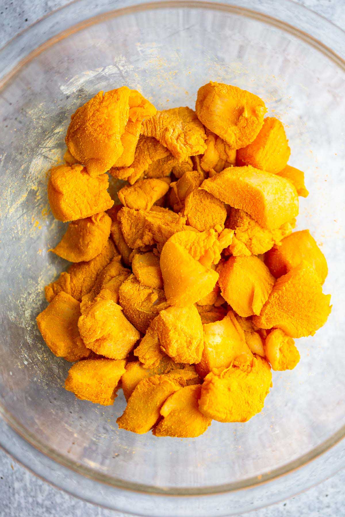 Chicken tossed with turmeric.