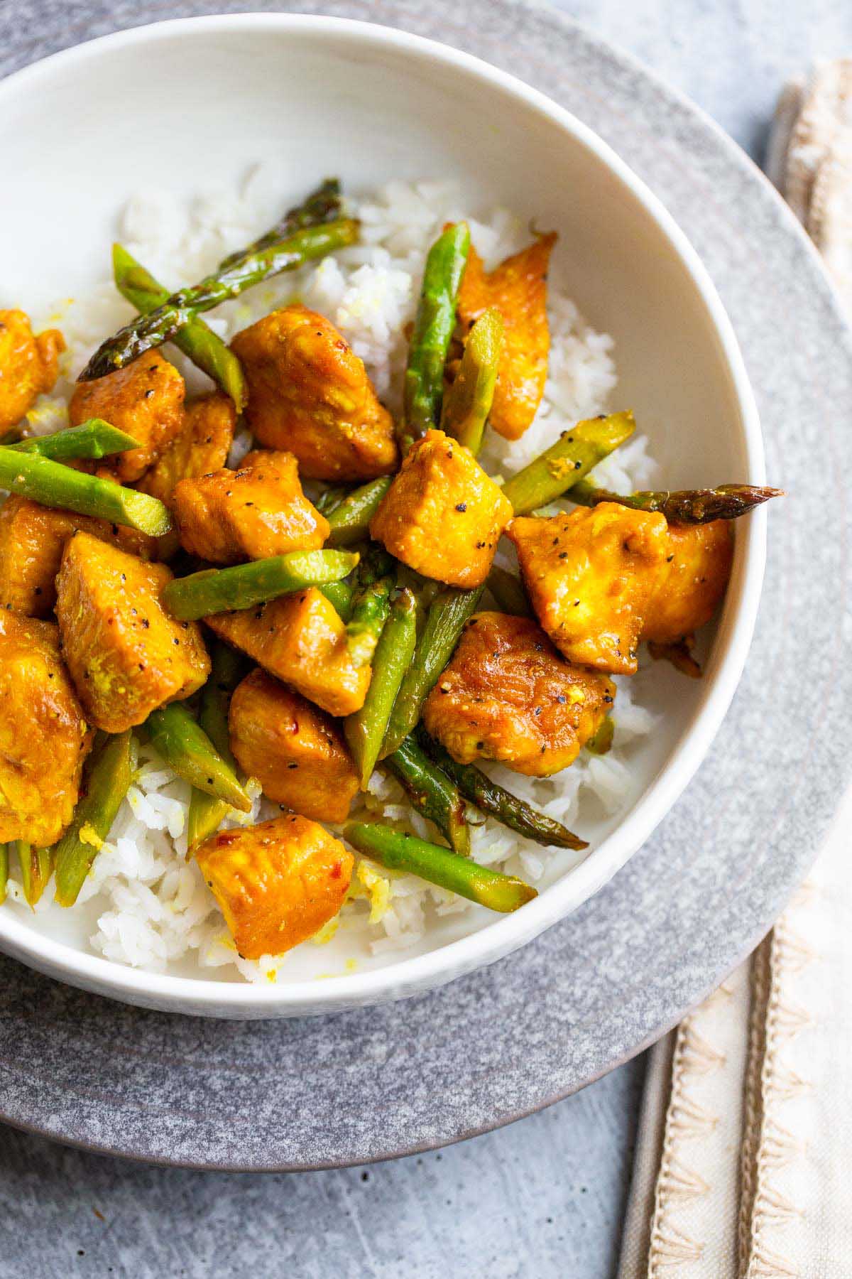Chicken and asparagus over rice.