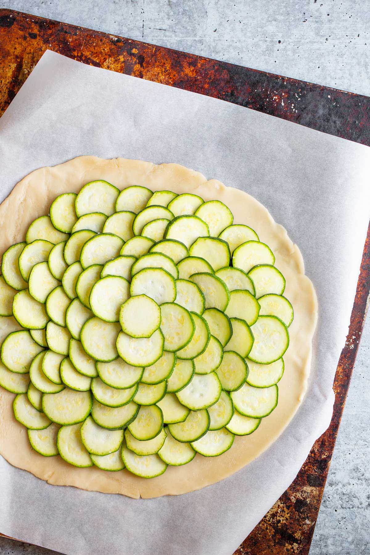 putting zucchini slices on a galette