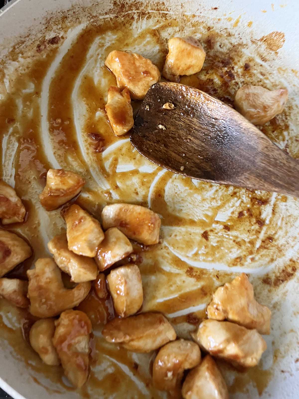 Chicken cooking in a skillet