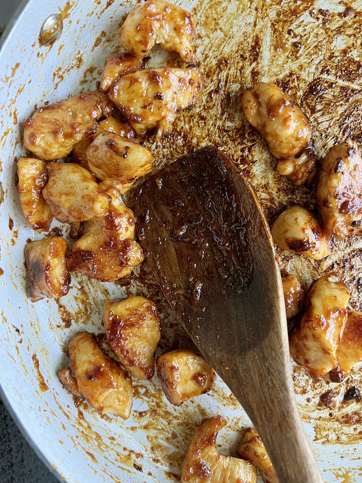 Chicken cooking in a skillet