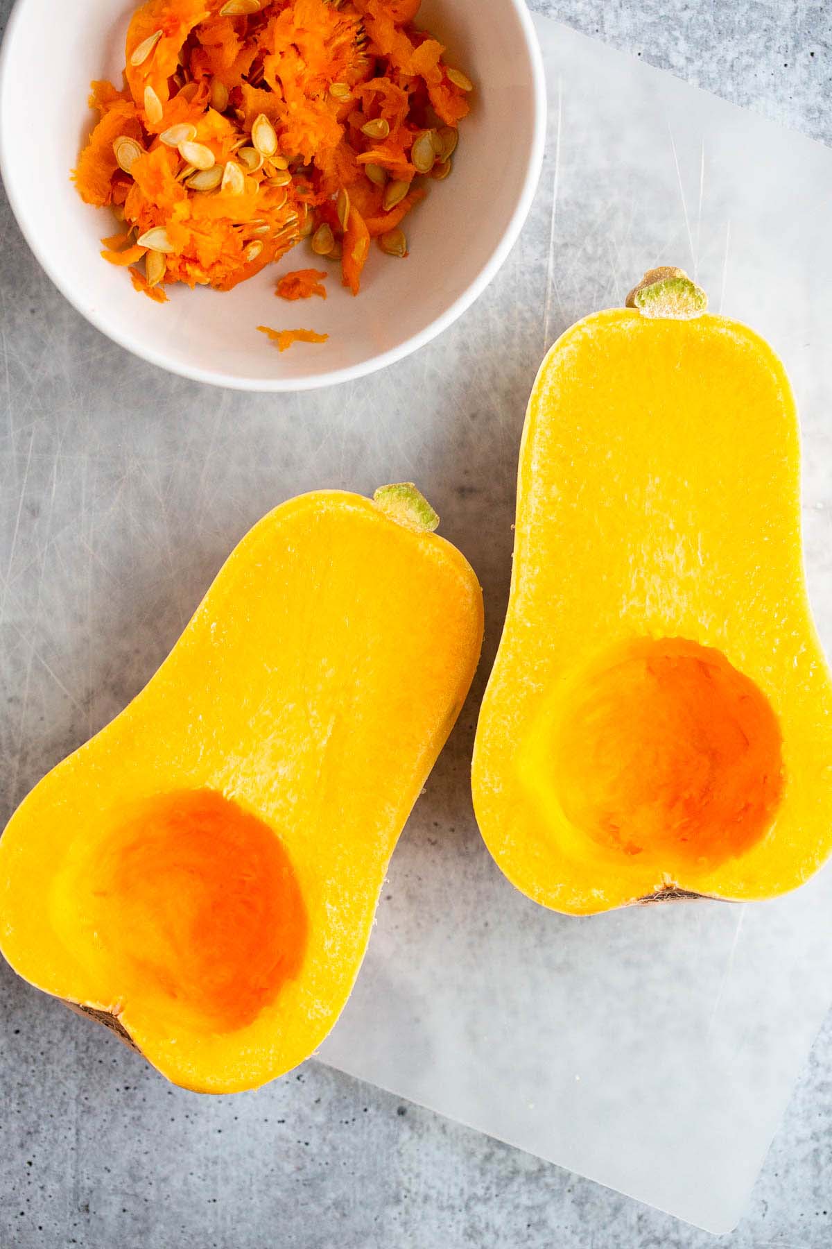 Butternut squash on a cutting board.