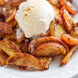 Cinnamon apple son a plate with ice cream