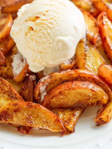 Air fryer apples topped with ice cream.