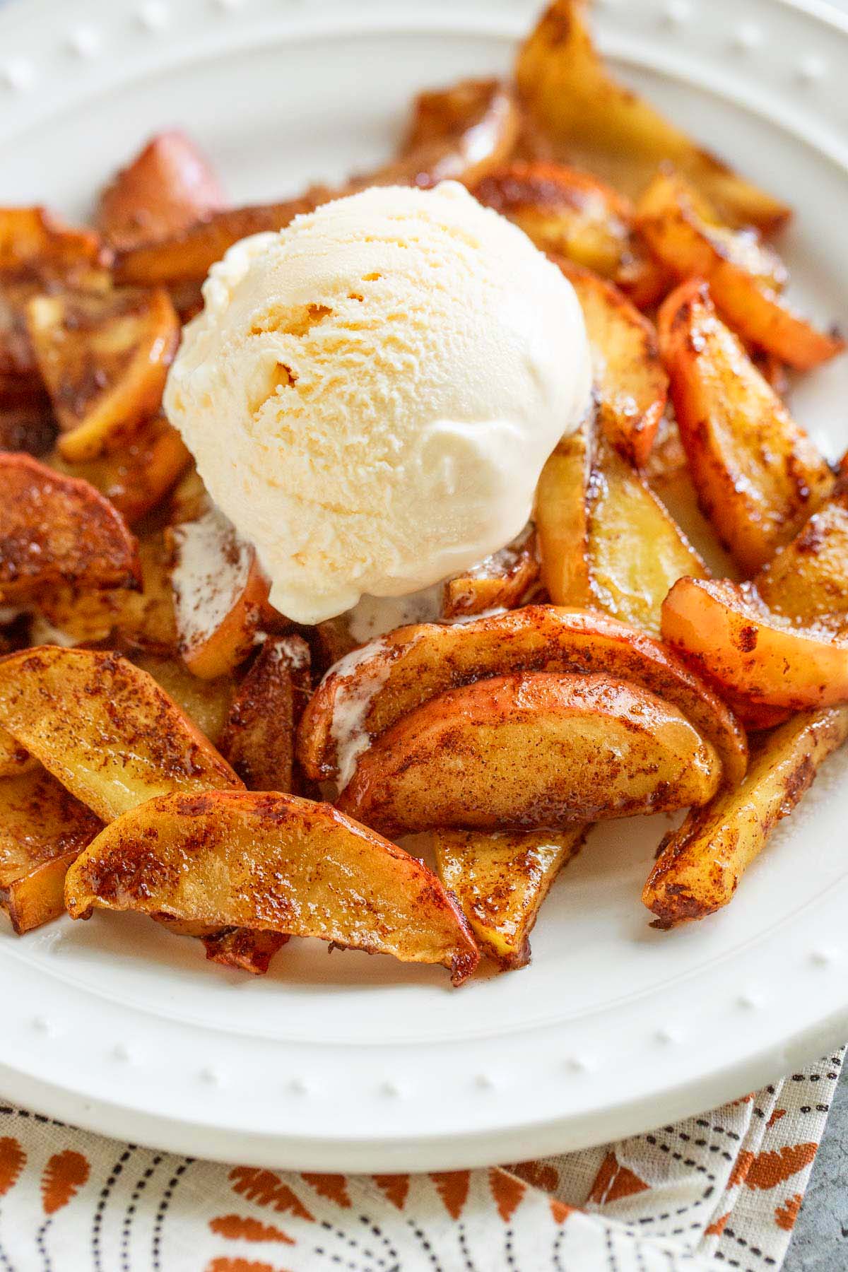 Air fryer apples topped with ice cream.