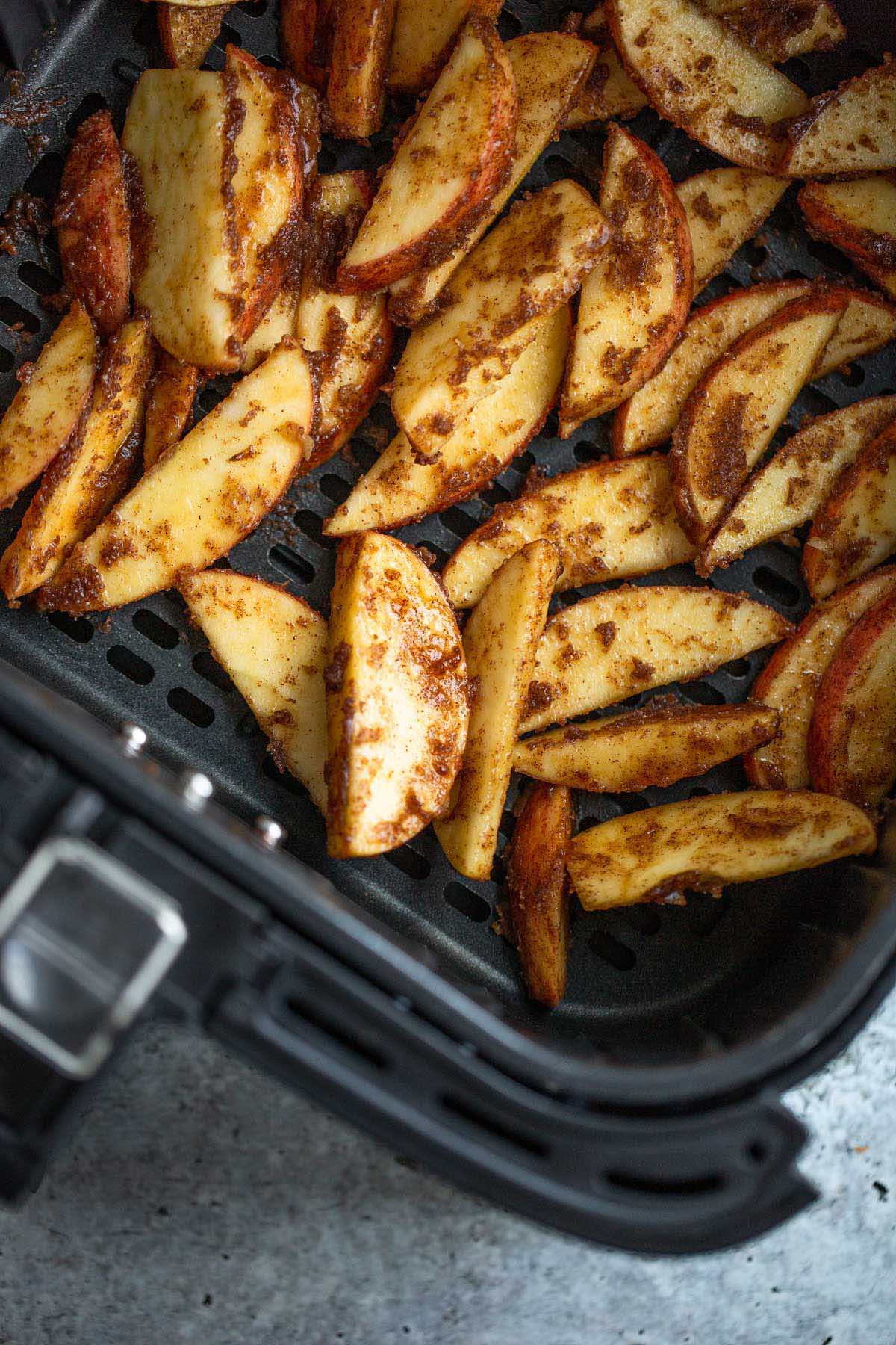 Uncooked cinnamon apples in air fryer