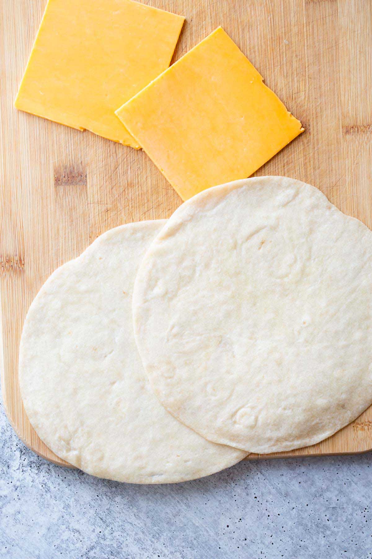 Tortillas and cheese slices.