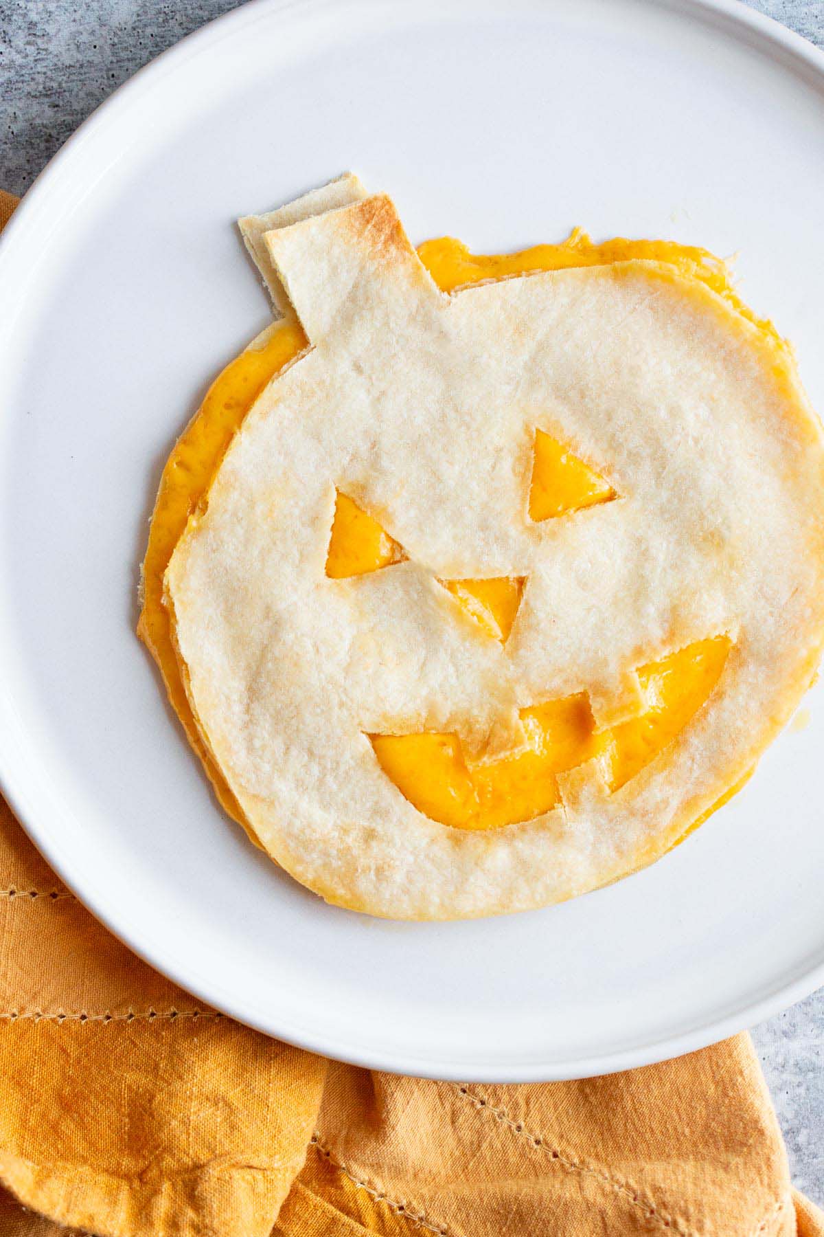 Halloween quesadilla on a plate.