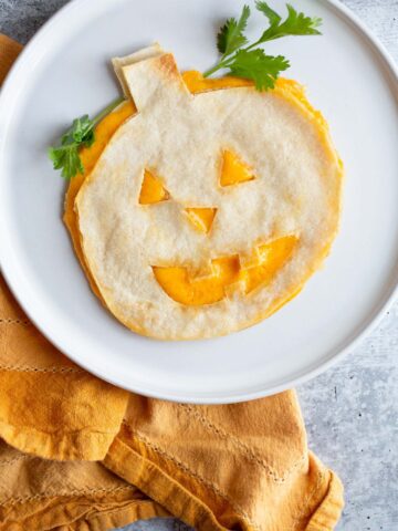 Halloween quesadilla with cilantro.