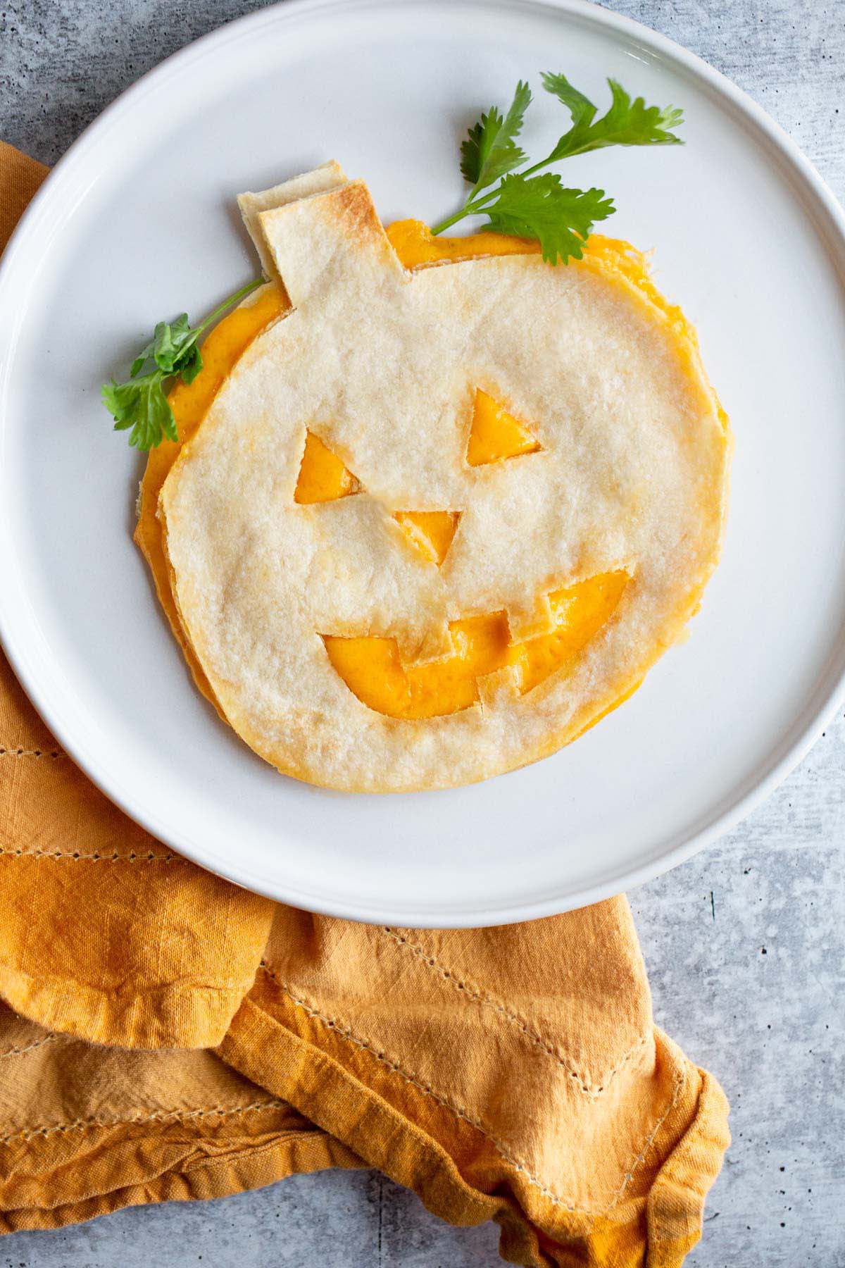 Halloween quesadilla with cilantro.