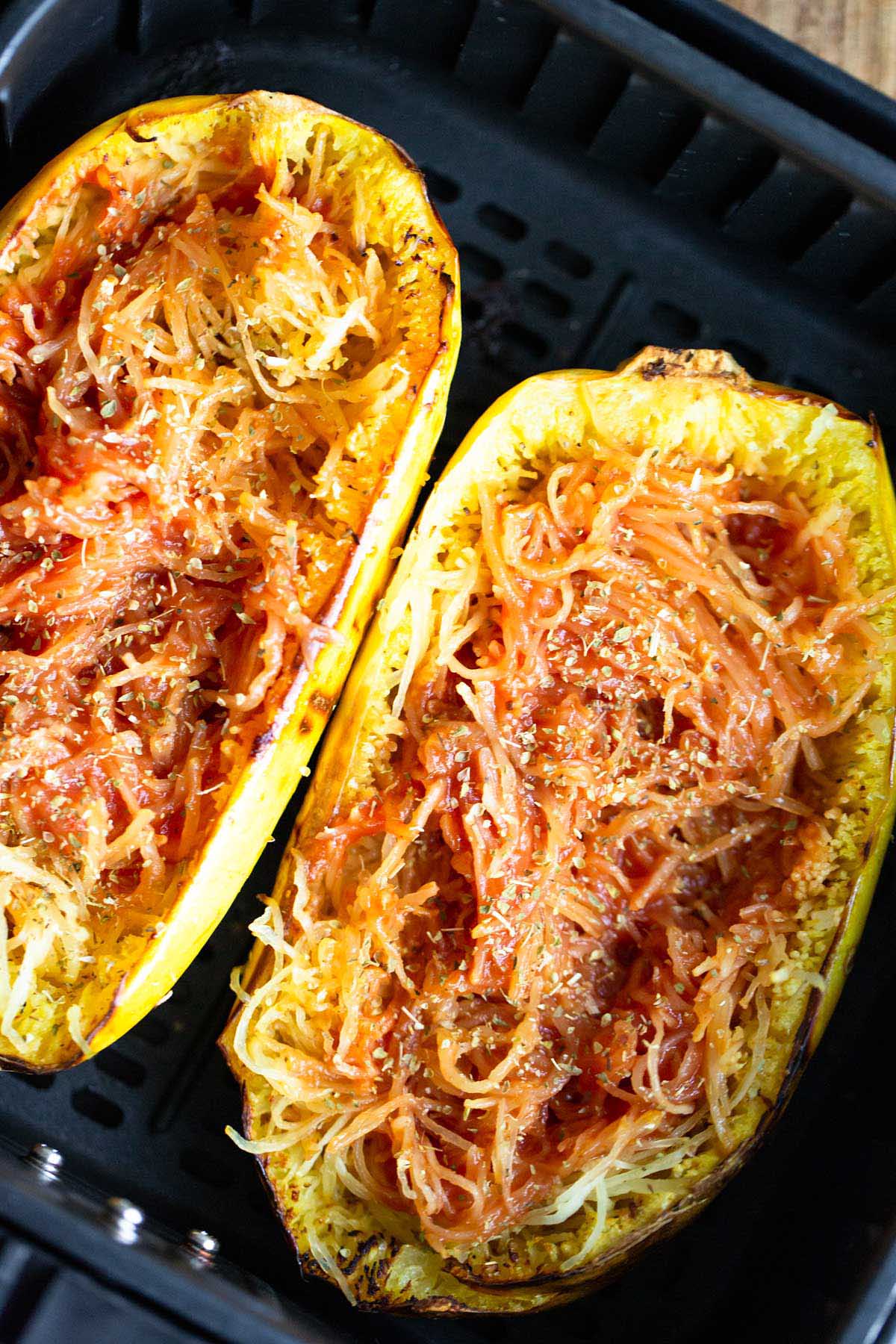 Spaghetti squash with tomato sauce mixed in.