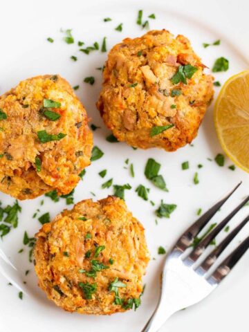 Air fryer tuna patties on a plate with a fork.