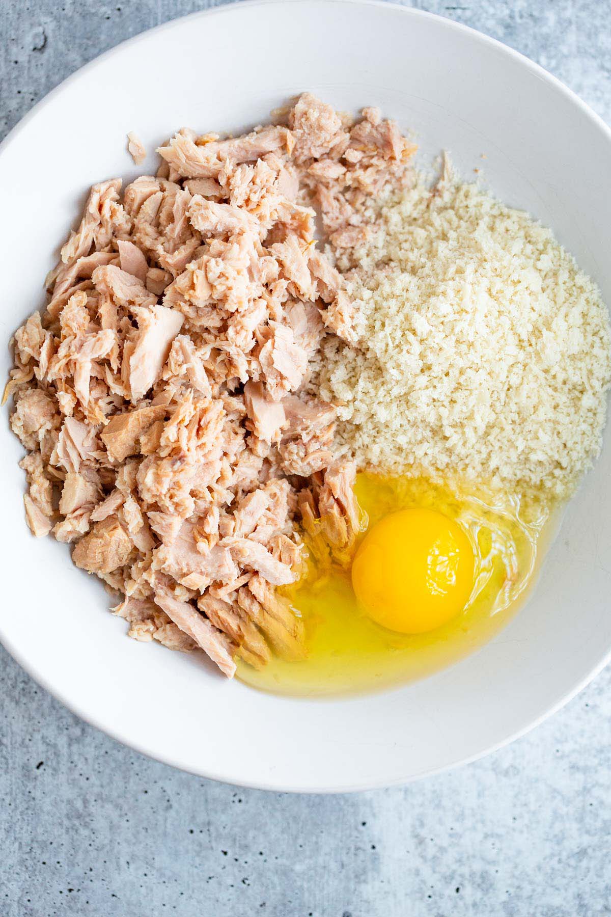 Tuna, panko, and egg in a bowl.