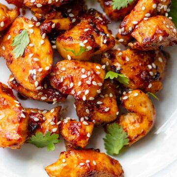 Honey sriracha chicken bites with sesame seeds up close