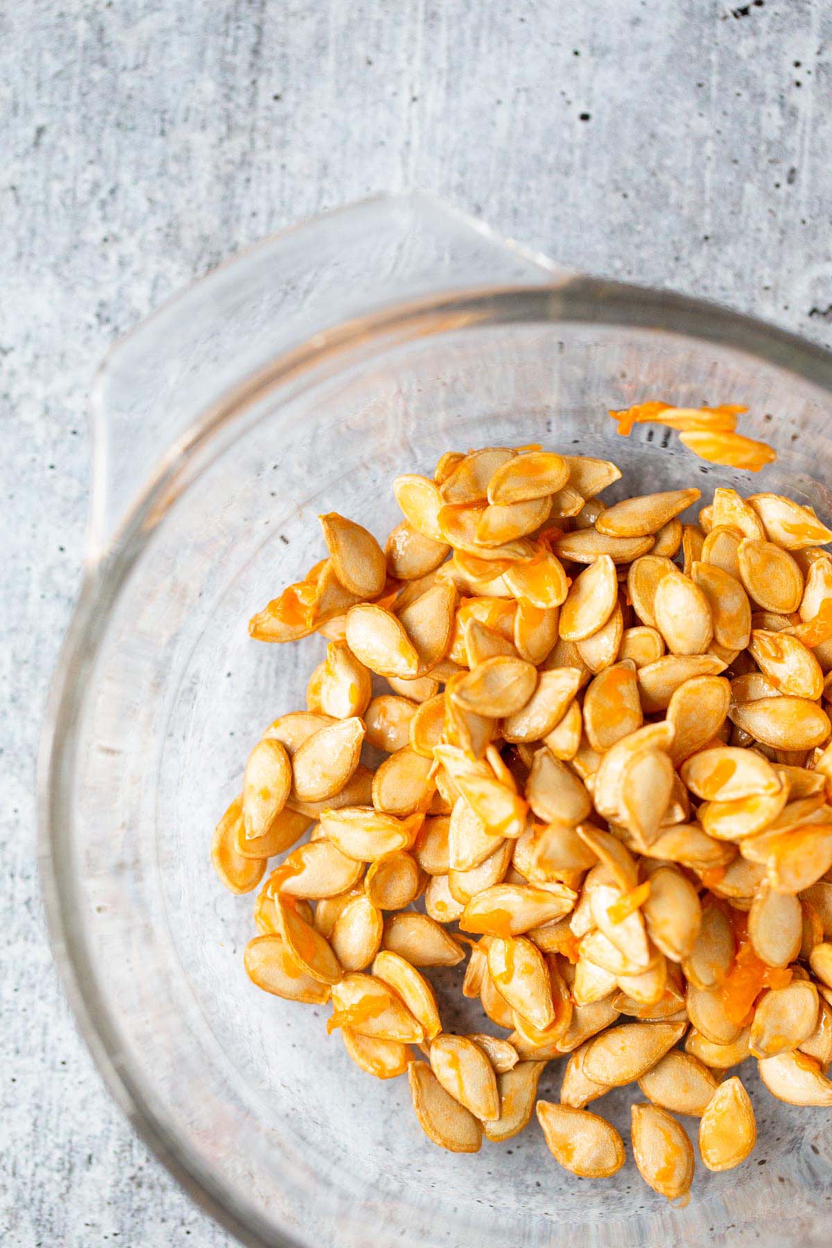 Squash seeds i a bowl waiting to be cleaned