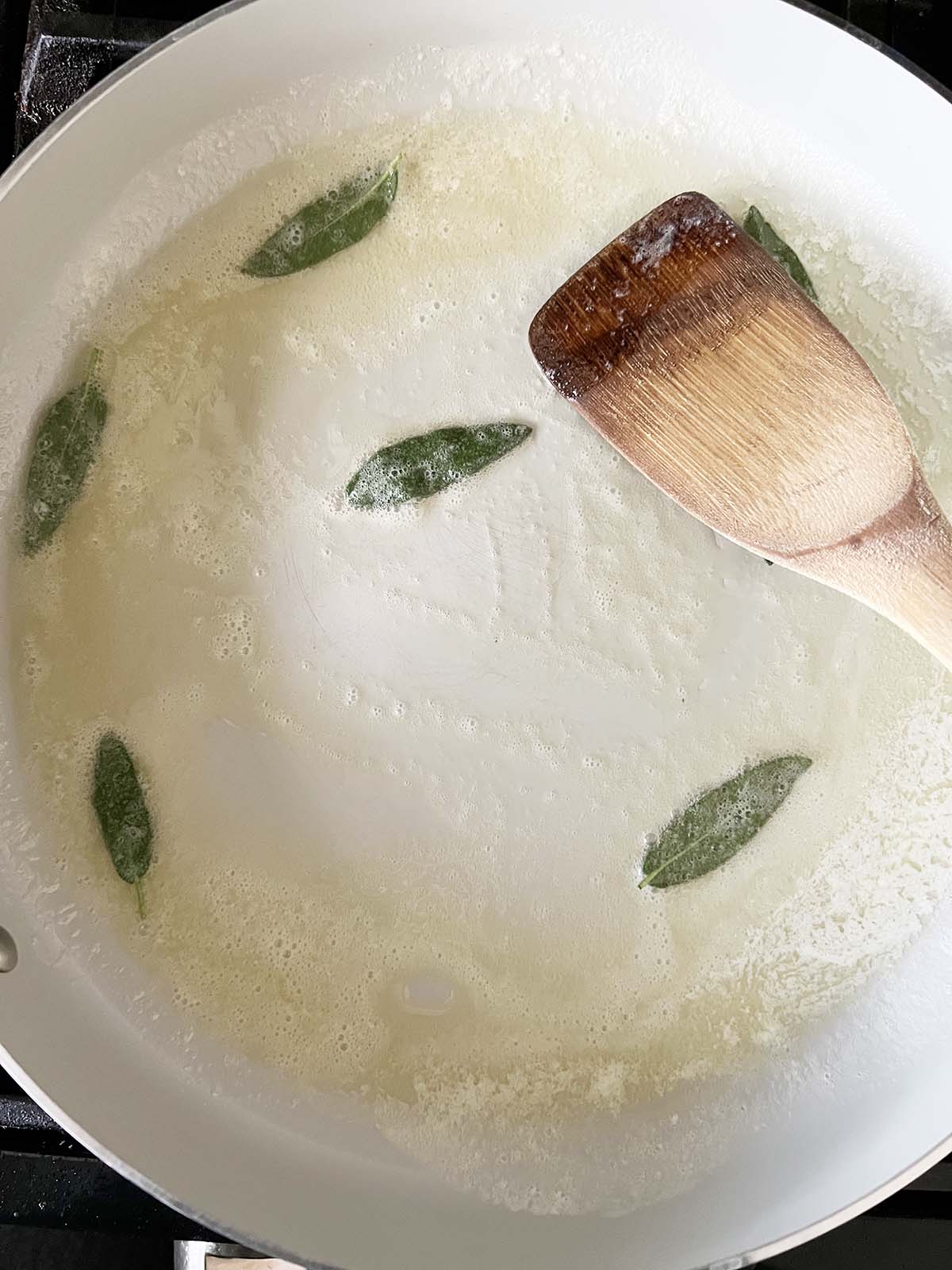 Making garlic sage butter.