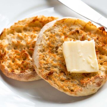 Toasted English muffin topped with butter.