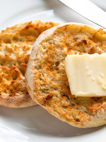 Toasted English muffin topped with butter.