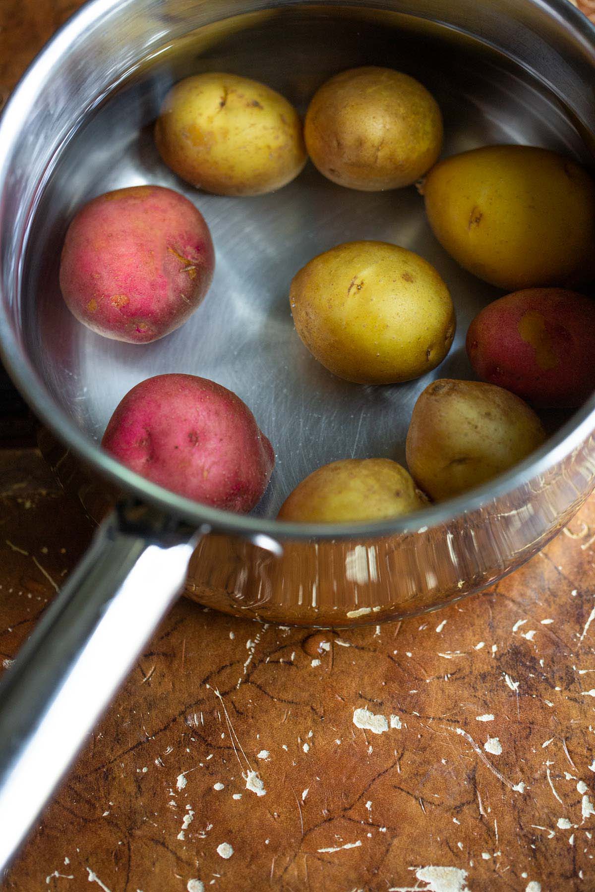 Potatoes in a pot with water.