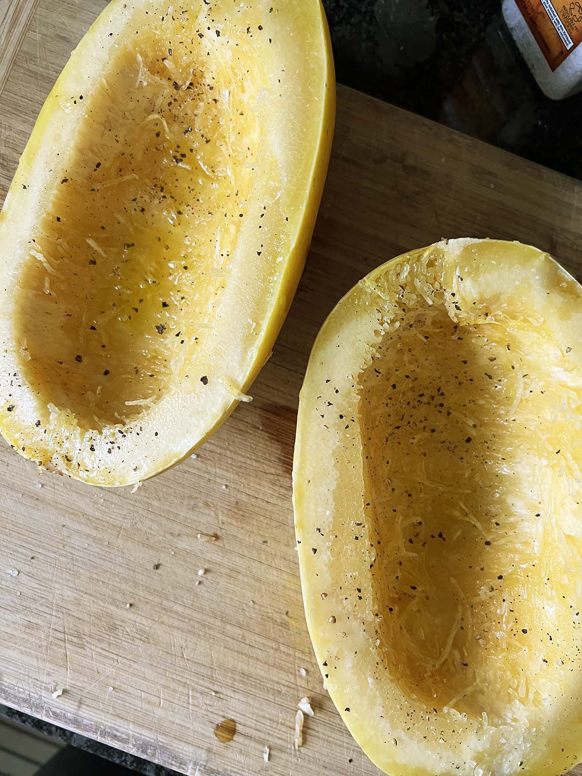 Scooping seeds out of spaghetti squash.